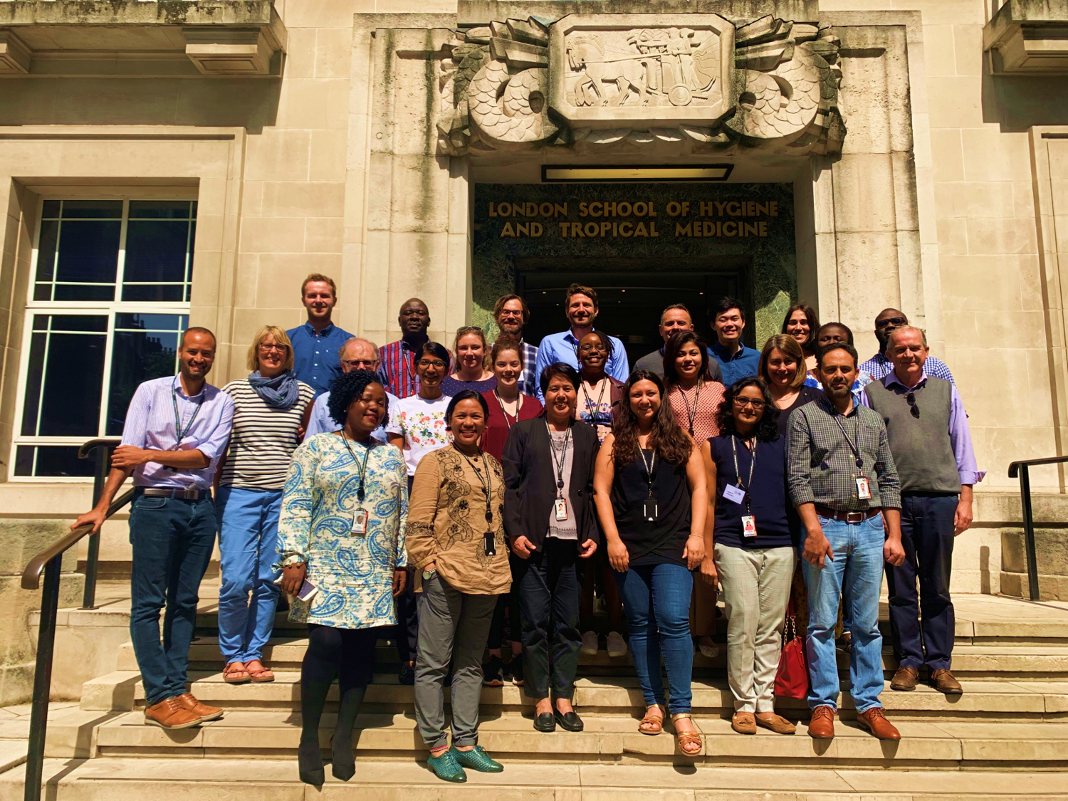 ICEH alumni stand on the steps of LSHTM 