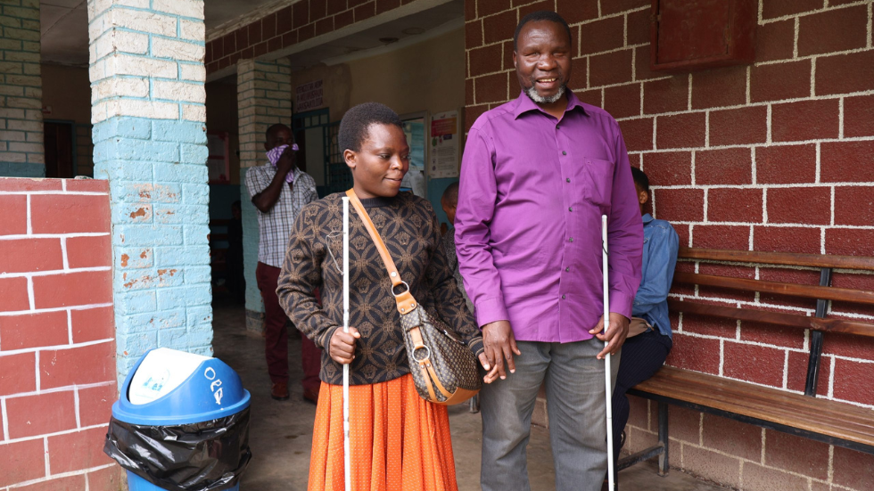 In Tanzania, a couple who are blind hold hands 
