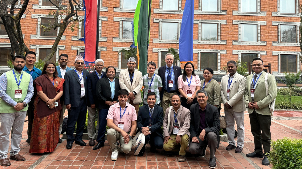 team members from ICEH and NNJS pose for a photo outside 