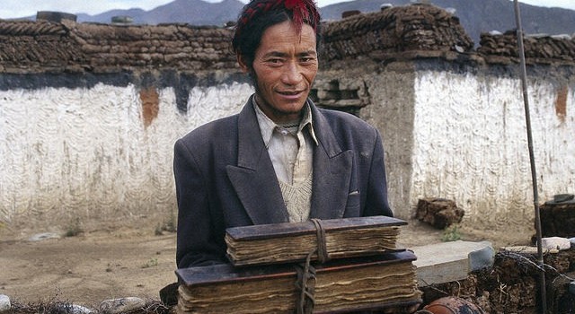A Tibetan doctor holding his family's medical texts (Theresia Hofer, Wellcome Images: https://www.flickr.com/photos/wellcomeimages/14933009688/)
