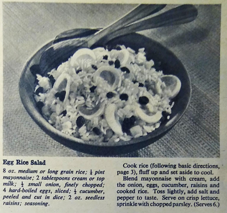 A black-and-white photograph from American Rice: My Home Cook Book depicting egg rice salad with the recipe printed below. It consists of 8oz medium grain rice, 1/4 pint mayonnaise, 2 tbsp cream, 1/2 small onion, finely chopped, 4 hard-boiled eggs, sliced, 1/2 cucumber, peeled and diced, 2oz seedless raisins, seasoning, lettuce, chopped parsley.