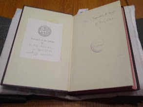 The endpapers of 'Two monographs on malaria and the parasites of malarial fevers,' showing a bookplate describing its donation to the Library and a handwritten inscription.