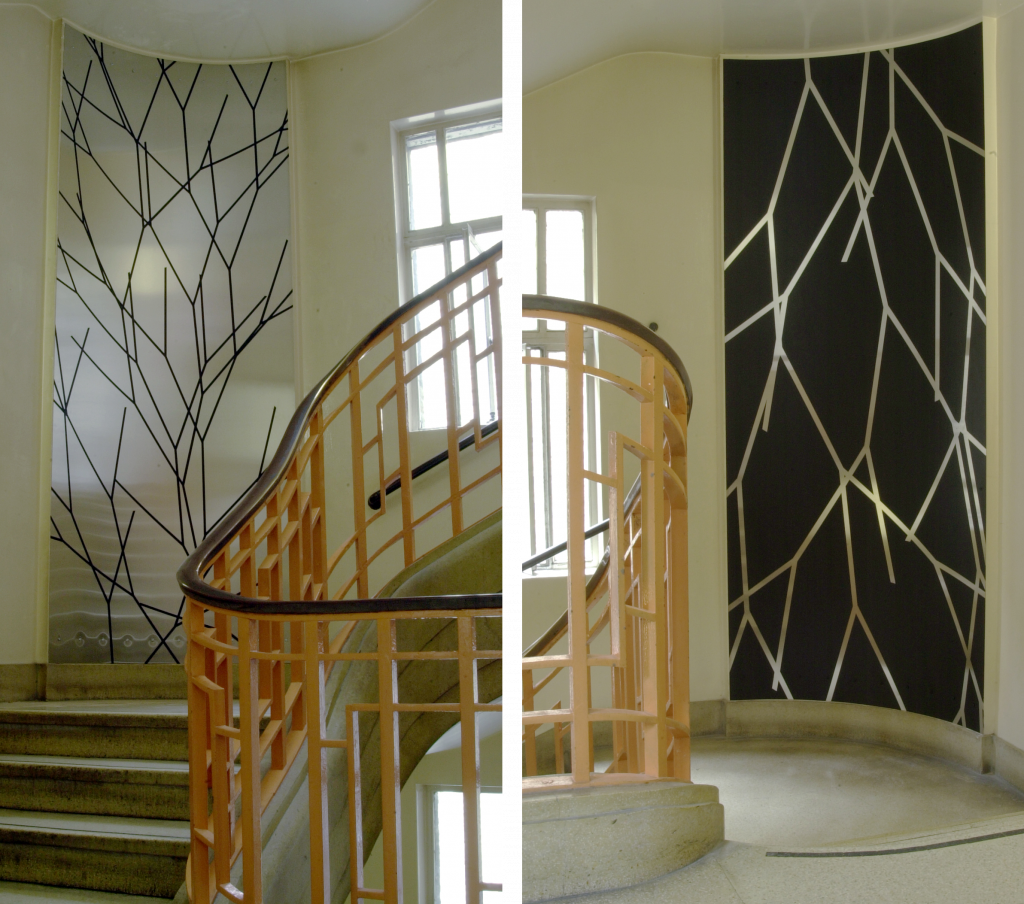 Geometric paintings on stainless steel in a stairwell