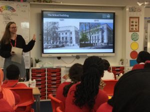 Jenny showing photos to school children 